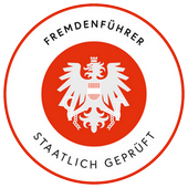 Logo de guide de ville en Autriche. Il doit être porté par les guides officiels durant les visites.